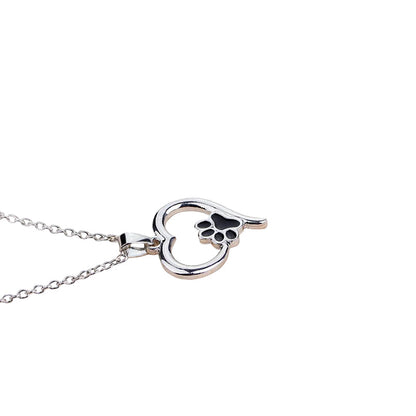 Collier MonPachaTech argenté avec pendentif cœur ajouré et motif patte de chien noir pour amoureux des animaux